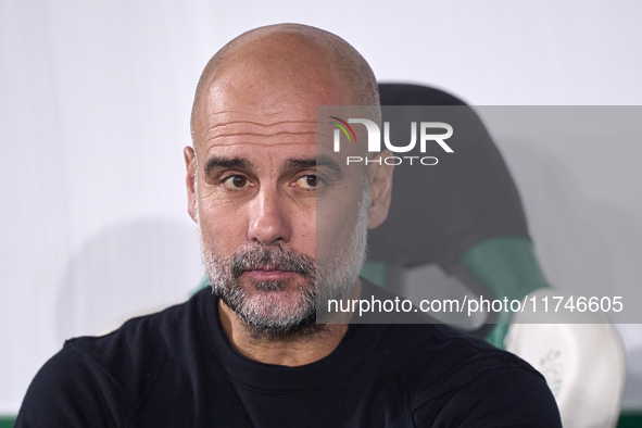 Pep Guardiola, Head Coach of Manchester City, looks on prior to the UEFA Champions League match between Sporting CP and Manchester City at J...