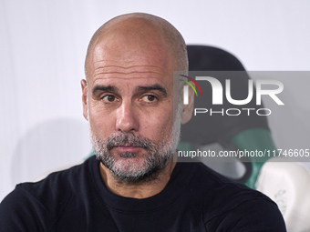 Pep Guardiola, Head Coach of Manchester City, looks on prior to the UEFA Champions League match between Sporting CP and Manchester City at J...