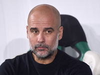 Pep Guardiola, Head Coach of Manchester City, looks on prior to the UEFA Champions League match between Sporting CP and Manchester City at J...