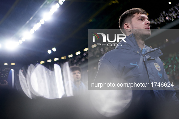 James McAtee of Manchester City looks on before the UEFA Champions League match between Sporting CP and Manchester City at Jose Alvalade Sta...