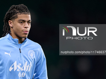 Jahmai Simpson-Pusey of Manchester City warms up before the UEFA Champions League match between Sporting CP and Manchester City at Jose Alva...