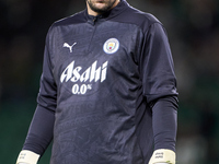 Stefan Ortega of Manchester City warms up before the UEFA Champions League match between Sporting CP and Manchester City at Jose Alvalade St...