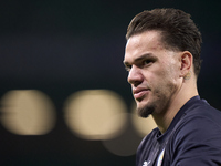 Ederson of Manchester City looks on during the warm-up before the UEFA Champions League match between Sporting CP and Manchester City at Jos...