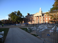 Debris and American flags are on the ground at an empty Howard University at the site of the Harris-Walz Election Night Headquarters followi...