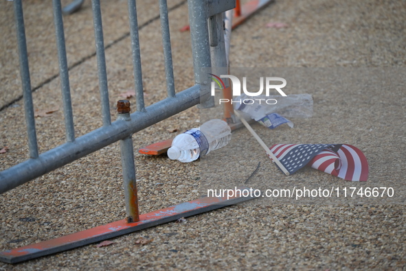 Debris and American flags are on the ground at an empty Howard University at the site of the Harris-Walz Election Night Headquarters followi...