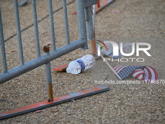 Debris and American flags are on the ground at an empty Howard University at the site of the Harris-Walz Election Night Headquarters followi...