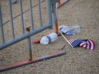 Debris and American flags are on the ground at an empty Howard University at the site of the Harris-Walz Election Night Headquarters followi...