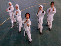 Little girls from Sopore town practice before their karate matches at an indoor stadium in Baramulla, Jammu and Kashmir, India, on November...