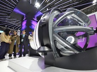 Visitors learn about the world's first radiation surgery robot model with a self-shielding function at the 7th CIIE in Shanghai, China, on N...