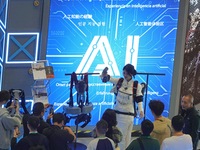 Visitors experience exoskeleton robot equipment at the 7th CIIE in Shanghai, China, on November 6, 2024. (