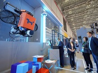 Visitors learn about exterior wall cleaning robots at the 7th CIEE in Shanghai, China, on November 6, 2024. (