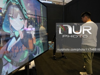 A staff member demonstrates full-body motion capture technology at the 7th CIIE in Shanghai, China, on November 6, 2024. (