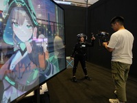 A staff member demonstrates full-body motion capture technology at the 7th CIIE in Shanghai, China, on November 6, 2024. (