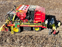 A farmer drives a large cotton picker to harvest cotton in Zhangye, China, on November 6, 2024. (