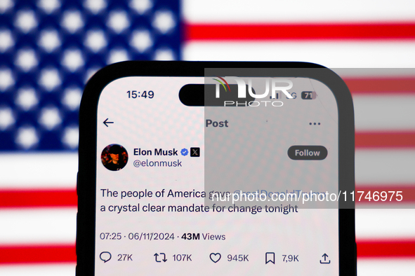 American flag displayed on a laptop screen and Elon Musk account on X displayed on a phone screen are seen in this illustration photo taken...