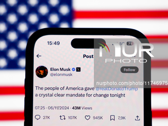 American flag displayed on a laptop screen and Elon Musk account on X displayed on a phone screen are seen in this illustration photo taken...