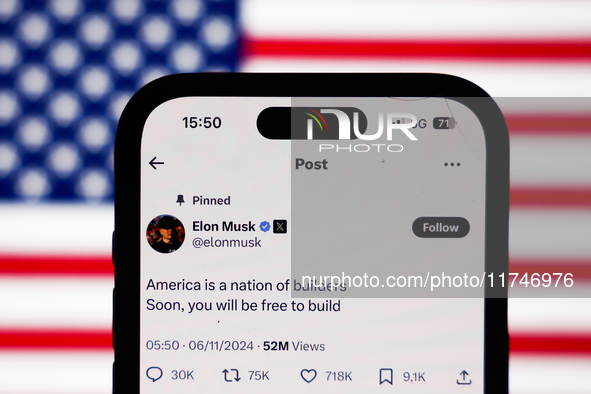 American flag displayed on a laptop screen and Elon Musk account on X displayed on a phone screen are seen in this illustration photo taken...