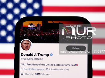 American flag displayed on a laptop screen and Donald Trump account on X displayed on a phone screen are seen in this illustration photo tak...