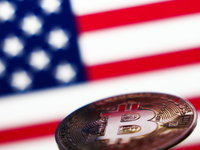 American flag displayed on a laptop screen and representation of Bitcoin cryptocurrency are seen in this illustration photo taken in Krakow,...