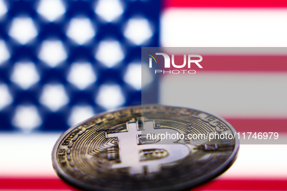 American flag displayed on a laptop screen and representation of Bitcoin cryptocurrency are seen in this illustration photo taken in Krakow,...