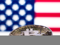 American flag displayed on a laptop screen and representation of Bitcoin cryptocurrency are seen in this illustration photo taken in Krakow,...