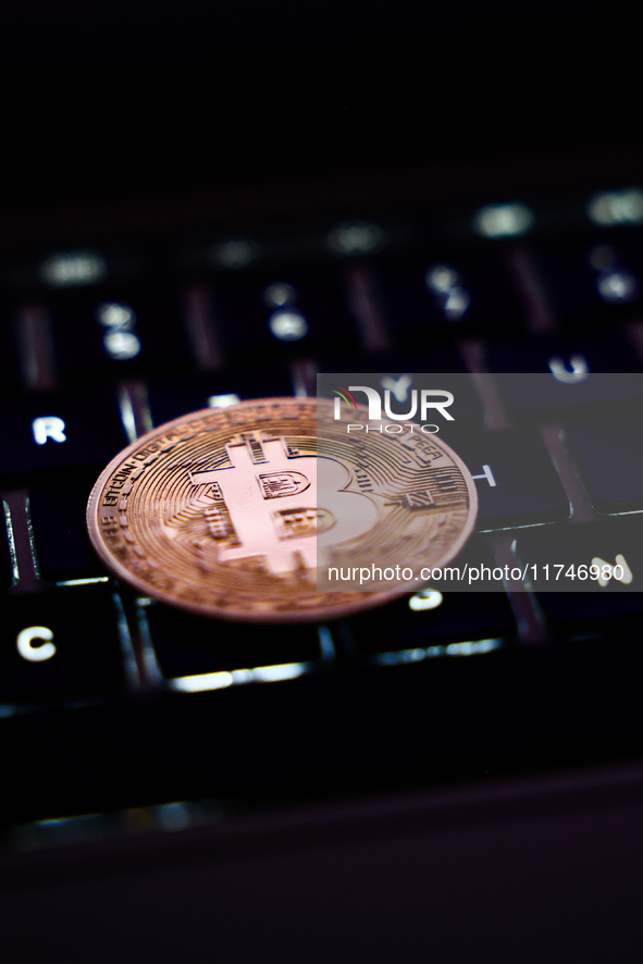 A laptop keyboard and representation of Bitcoin cryptocurrency are seen in this illustration photo taken in Krakow, Poland on November 6, 20...