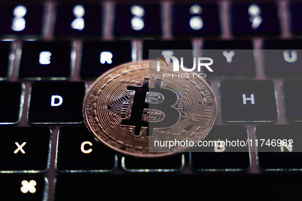 A laptop keyboard and representation of Bitcoin cryptocurrency are seen in this illustration photo taken in Krakow, Poland on November 6, 20...