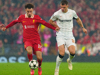 Liverpool's Curtis Jones battles with Granit Xhaka of Bayer Leverkusen during the UEFA Champions League 2024/25 League Phase MD4 match betwe...