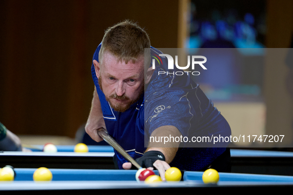 A participant from the Scotland Pool Association men's team performs during one of the events at the inaugural IBF World Blackball Champions...