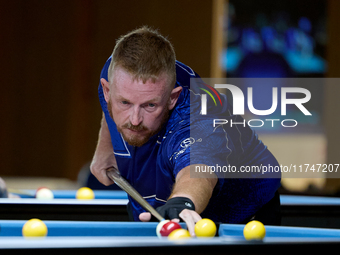 A participant from the Scotland Pool Association men's team performs during one of the events at the inaugural IBF World Blackball Champions...