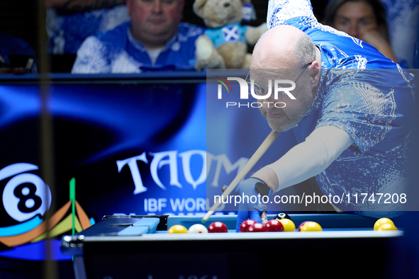 A participant from the Scotland Pool Association men's team performs during one of the events at the inaugural IBF World Blackball Champions...