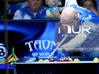 A participant from the Scotland Pool Association men's team performs during one of the events at the inaugural IBF World Blackball Champions...