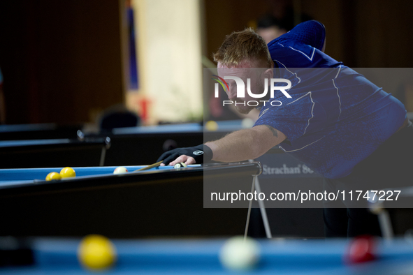 A participant from the Scotland Pool Association men's team performs during one of the events at the inaugural IBF World Blackball Champions...