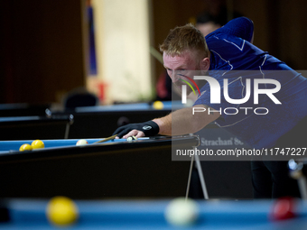 A participant from the Scotland Pool Association men's team performs during one of the events at the inaugural IBF World Blackball Champions...