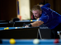 A participant from the Scotland Pool Association men's team performs during one of the events at the inaugural IBF World Blackball Champions...