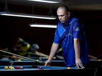 A participant from the Scotland Pool Association men's team reflects during one of the events at the inaugural IBF World Blackball Champions...