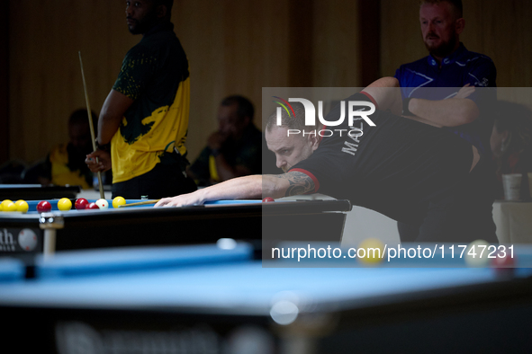 A participant from the Malta Blackball Association men's team performs during one of the events at the inaugural IBF World Blackball Champio...