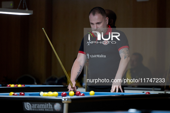 A participant from the Malta Blackball Association men's team gestures during one of the events at the inaugural IBF World Blackball Champio...