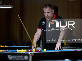 A participant from the Malta Blackball Association men's team gestures during one of the events at the inaugural IBF World Blackball Champio...