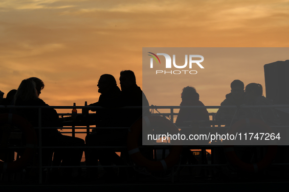 A boat floats on the Vistula River at sunset in Krakow, Poland, on October 27, 2024. 