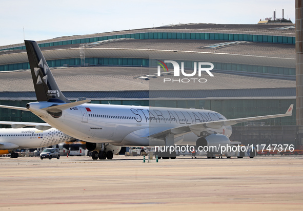 An Airbus A330-343 from Air China, featuring the Star Alliance livery, parks at the terminal shortly before its departure from Barcelona air...