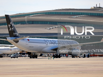 An Airbus A330-343 from Air China, featuring the Star Alliance livery, parks at the terminal shortly before its departure from Barcelona air...