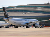 An Airbus A330-343 from Air China, featuring the Star Alliance livery, parks at the terminal shortly before its departure from Barcelona air...