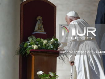 Pope Francis places a white rose on the statue of the Madonna of Valencia before the weekly general audience at St. Peter's Square in The Va...