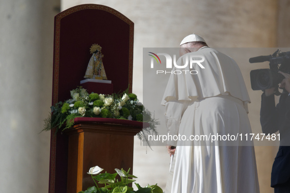 Pope Francis places a white rose on the statue of the Madonna of Valencia before the weekly general audience at St. Peter's Square in The Va...