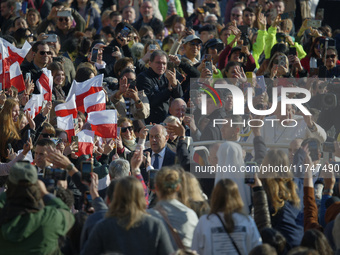 Pope Francis waves to pilgrims after attending the weekly general audience at St. Peter's Square in The Vatican on November 6, 2024. (