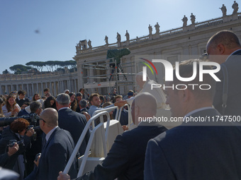 Pope Francis greets and talks with a group of students at the end of his general weekly audience in Vatican City, on November 6, 2024. (