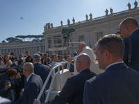 Pope Francis greets and talks with a group of students at the end of his general weekly audience in Vatican City, on November 6, 2024. (