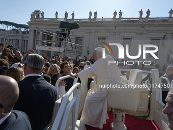 Pope Francis greets and talks with a group of students at the end of his general weekly audience in Vatican City, on November 6, 2024. (