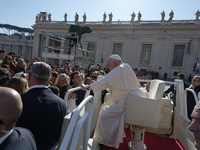 Pope Francis greets and talks with a group of students at the end of his general weekly audience in Vatican City, on November 6, 2024. (